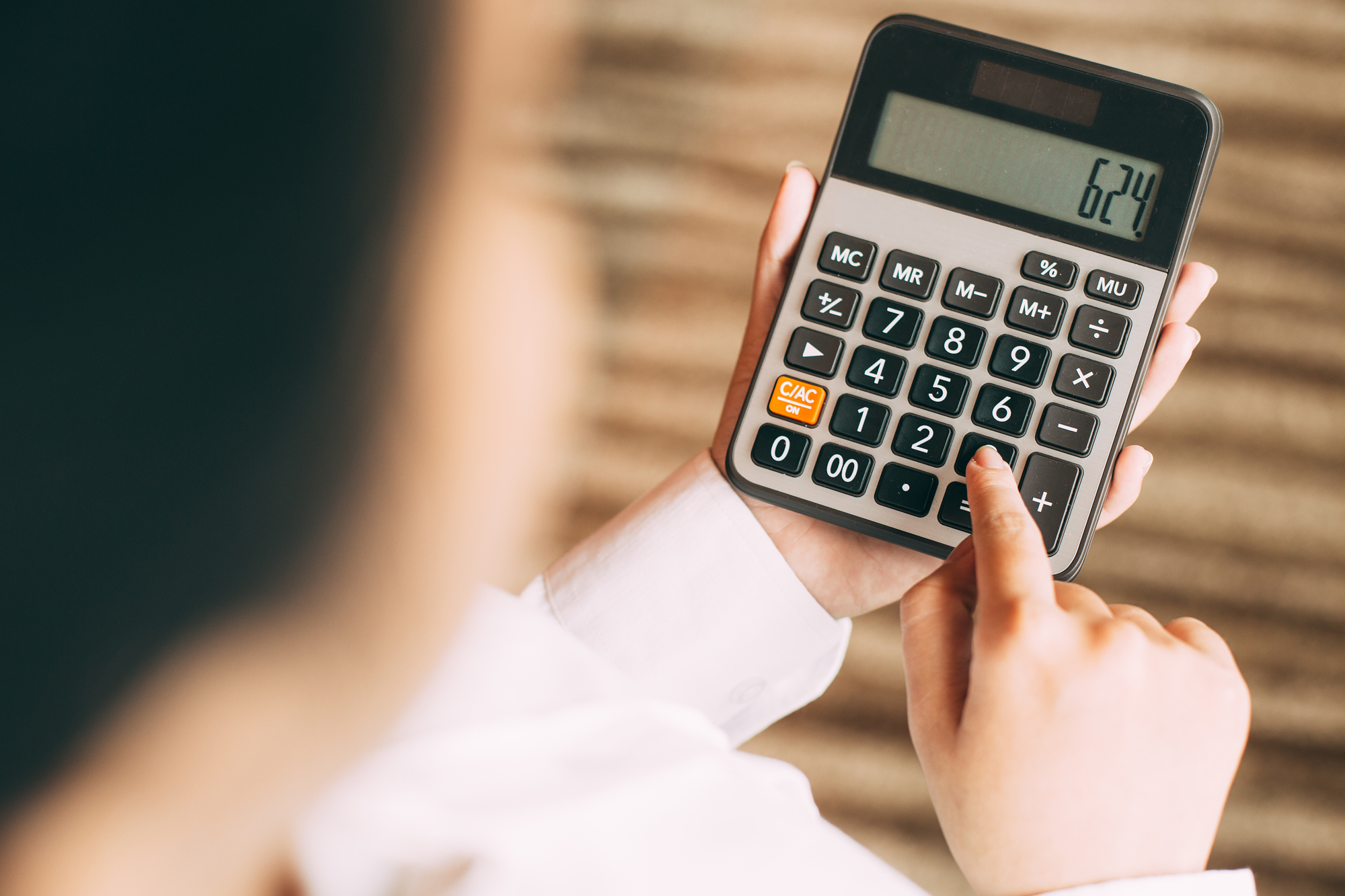 calculator-calculating-young-button-checking.jpg